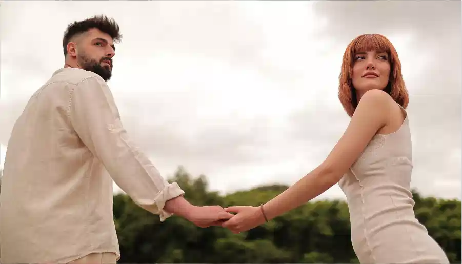 man and woman holding hands