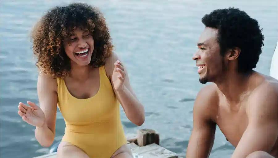 A woman giving attention to a man.